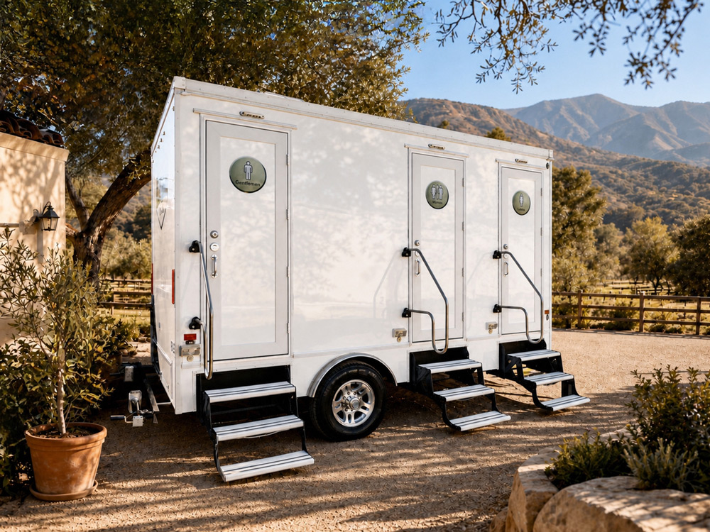 3-stall luxury restroom trailer from Major Event Trailers at an outdoor ranch event in Santa Paula, California.